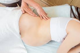 Pregnant lady being massaged