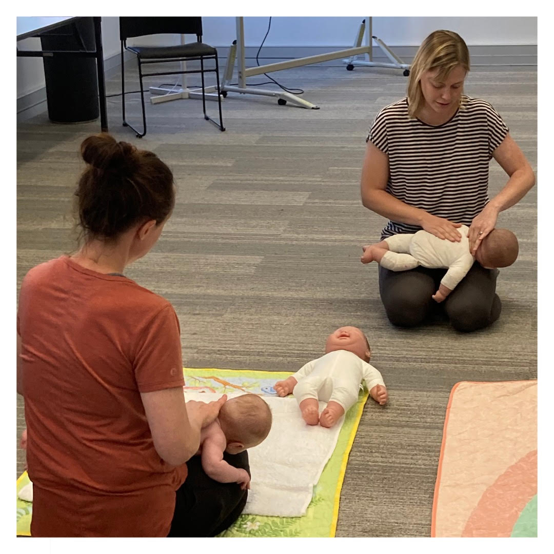Ainslie Davies demonstrating infant massage to a class